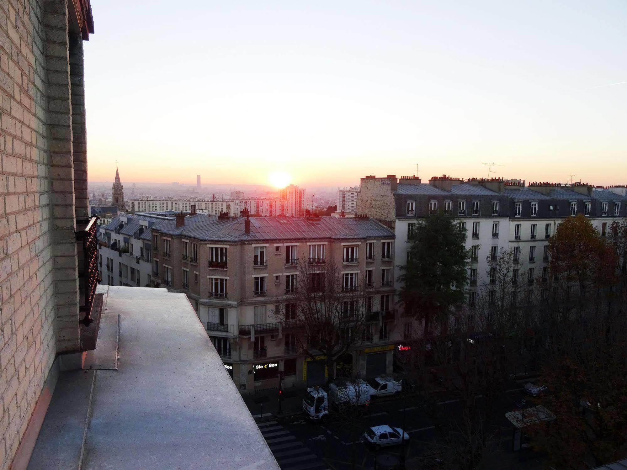 Hotel Ermitage Paris Exterior foto Sunset over Paris